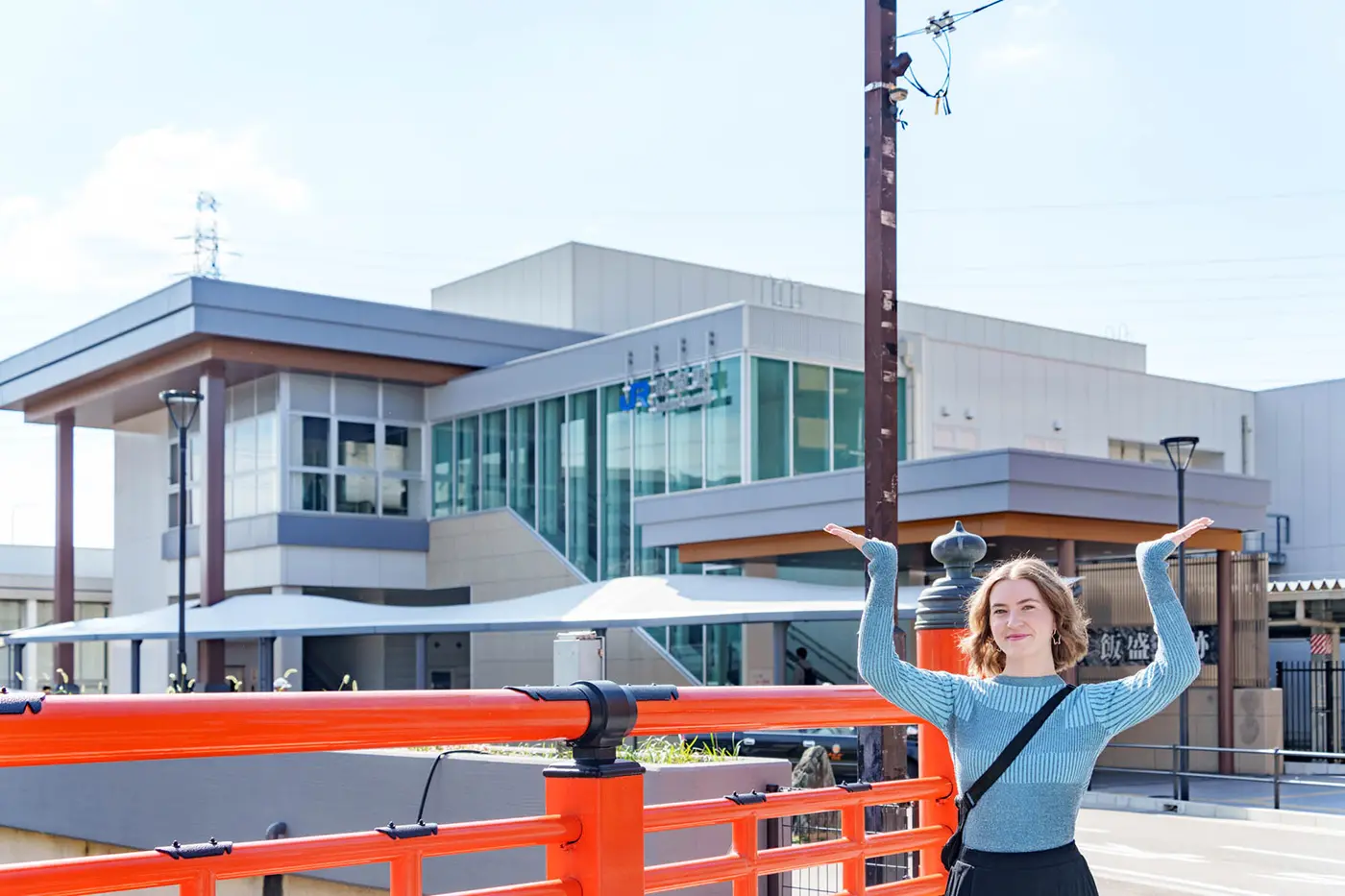 Posing in front of Kyobashi Station