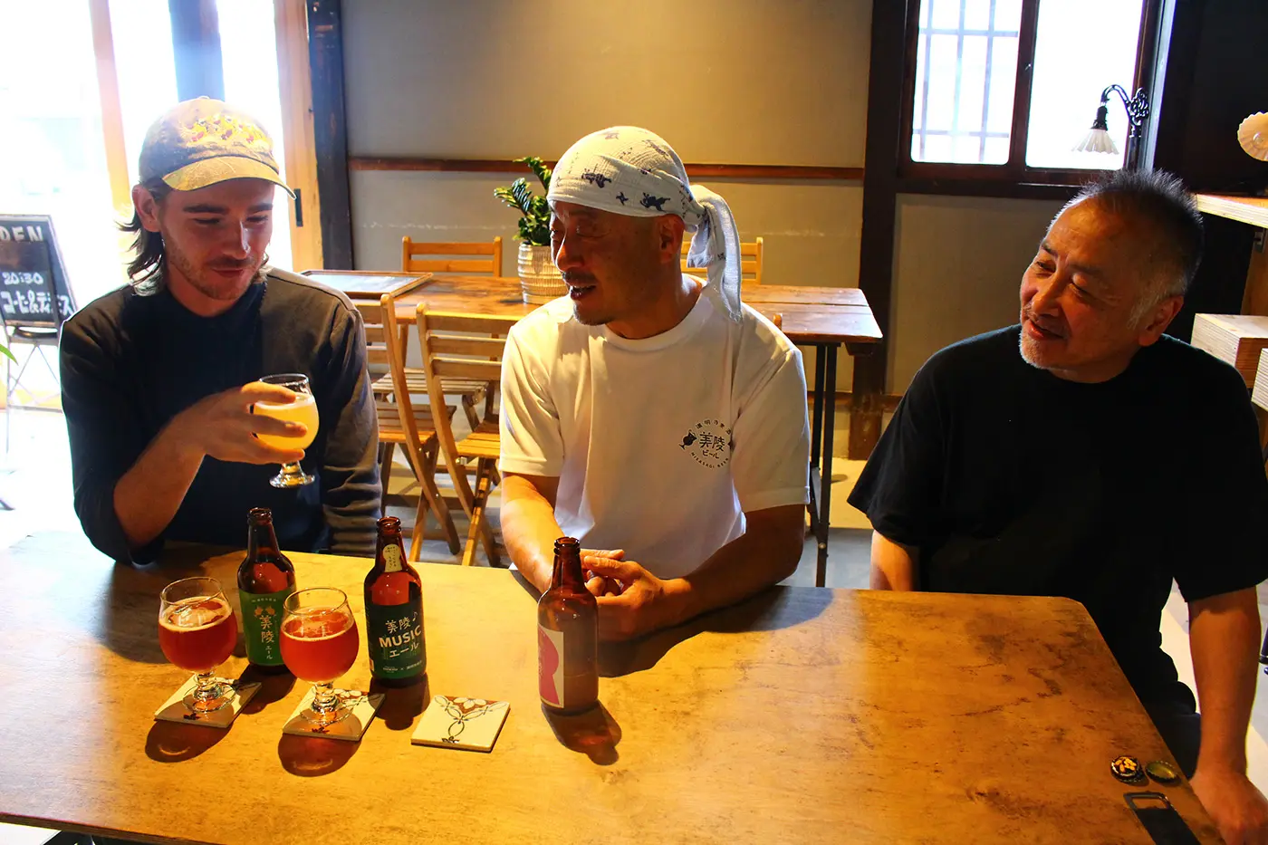 Jackie takes a sip of beer