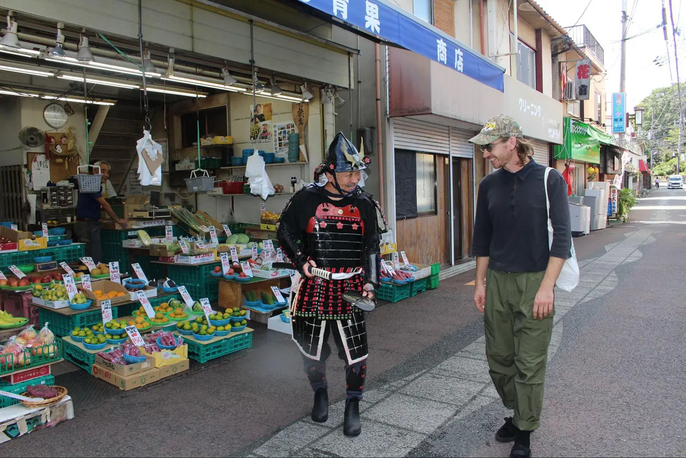 Two people walking through town
