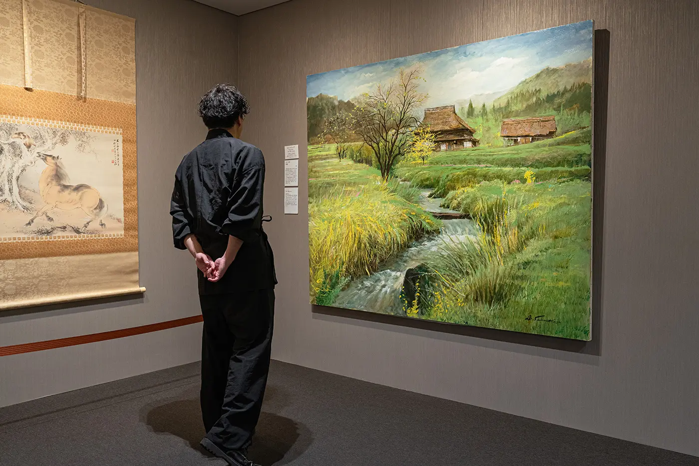 Minahada appreciating the artwork