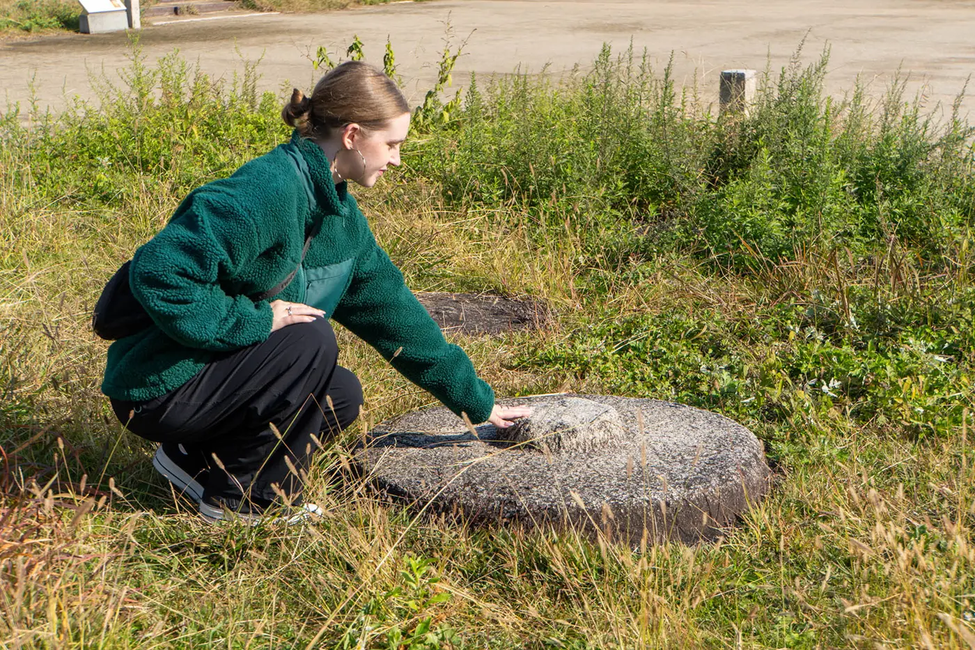 Kira touching the cornerstone