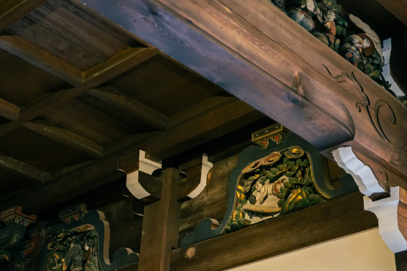 A sculpture of a son lying naked on ice searching for fish for his stepmother