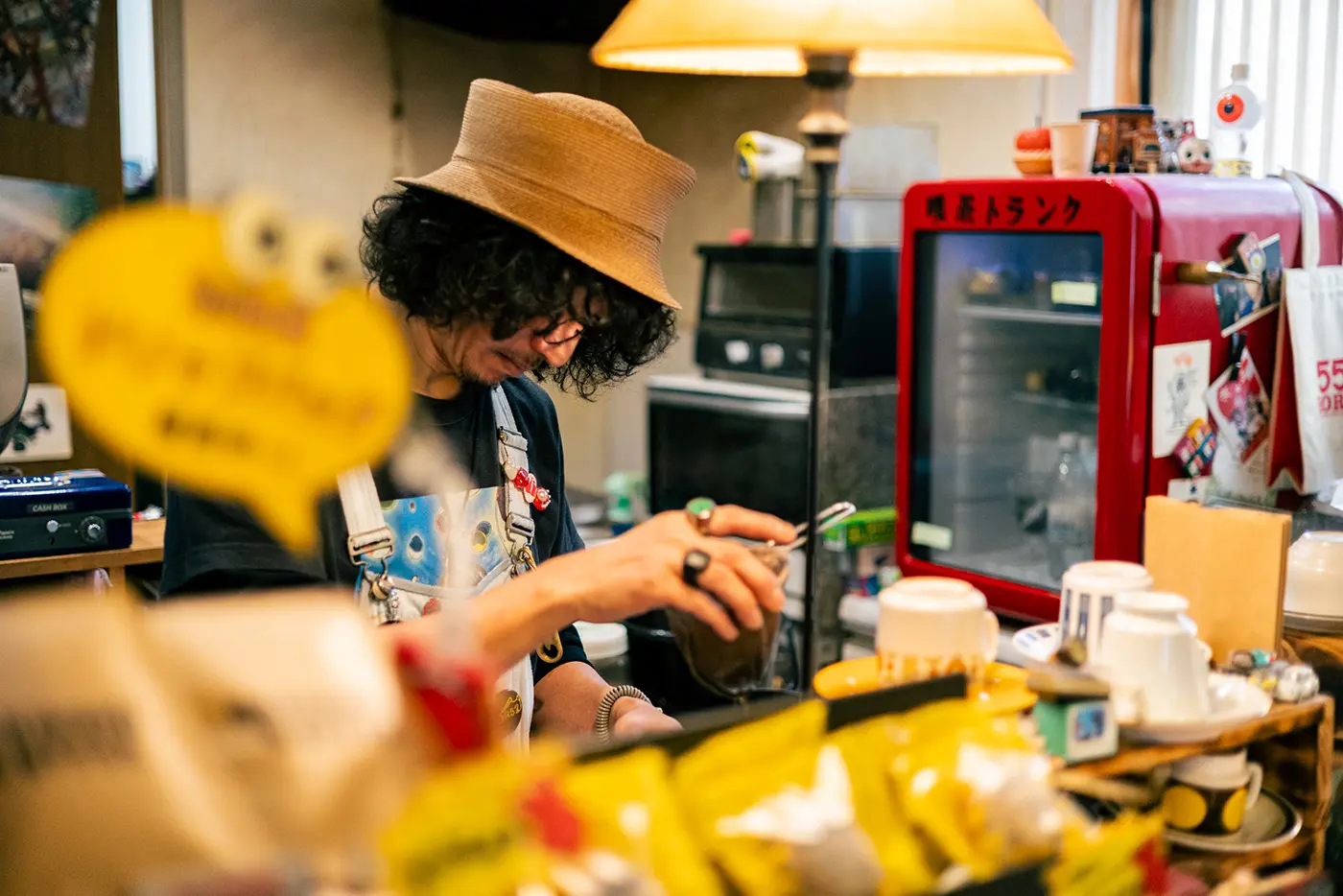 Shop owner brewing coffee