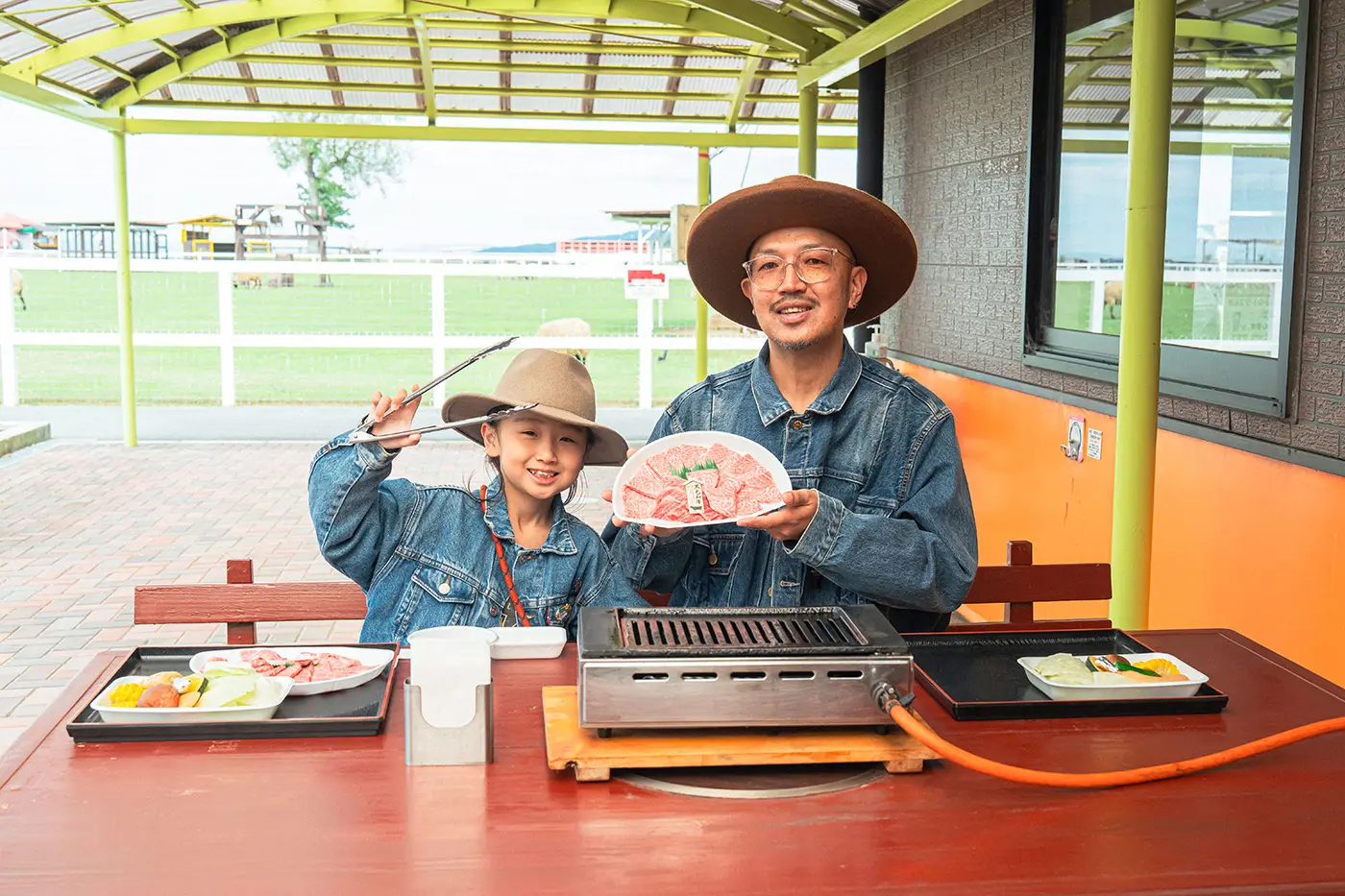 Parents and children enjoying a BBQ on the terrace