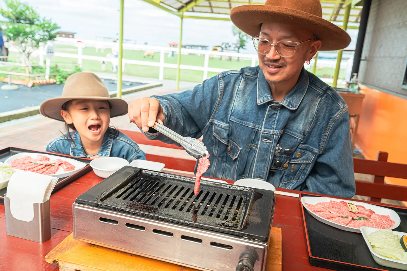 Parents and children enjoying a BBQ