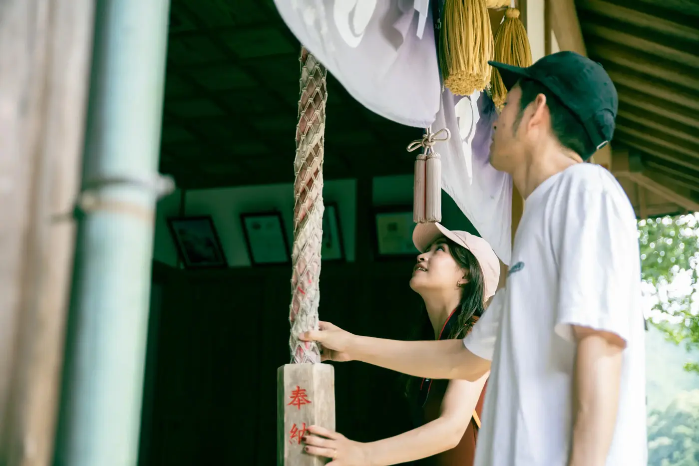 With the bell rope of the worship hall in hand
