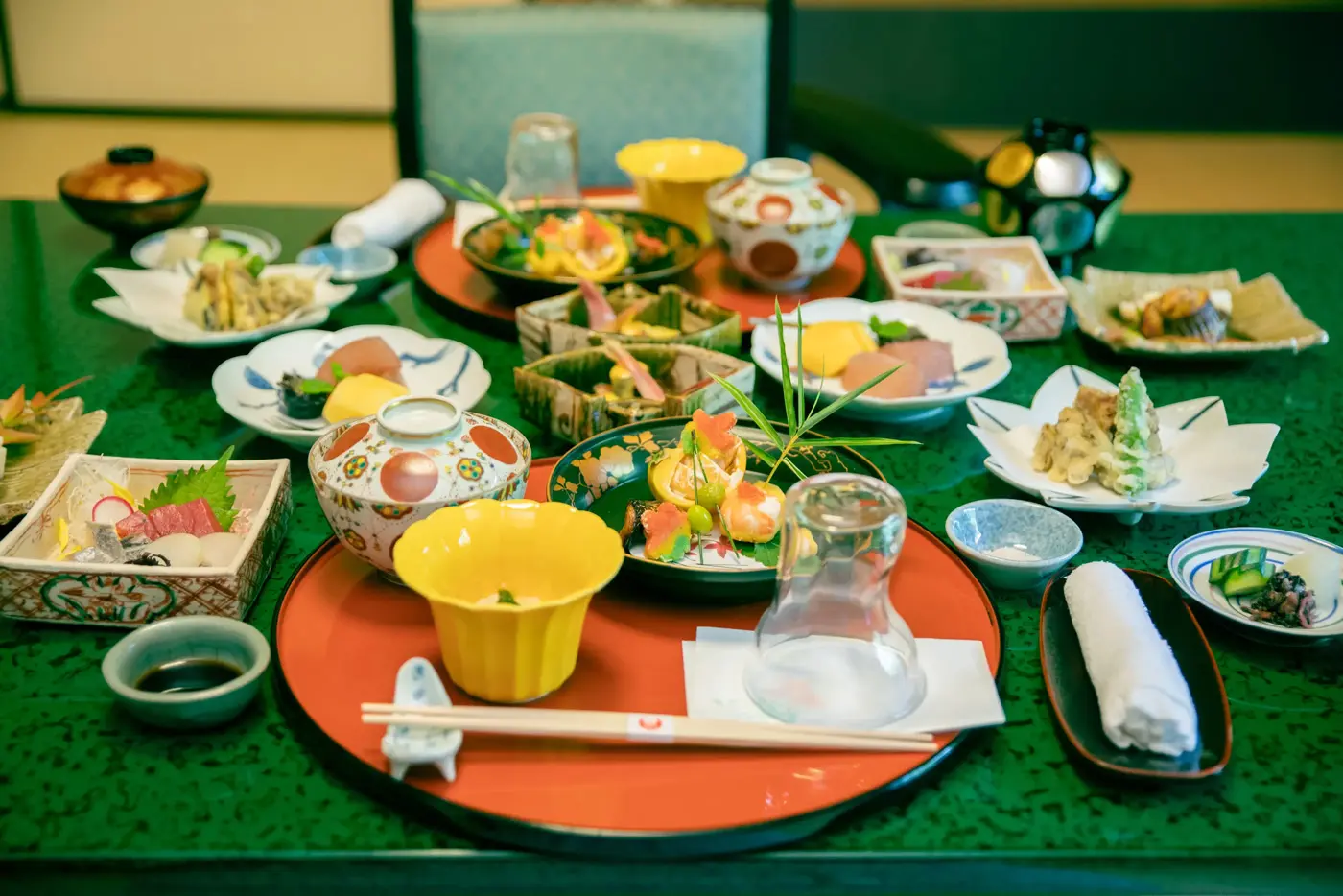 Luxurious kaiseki cuisine served on a table in a Japanese-style room