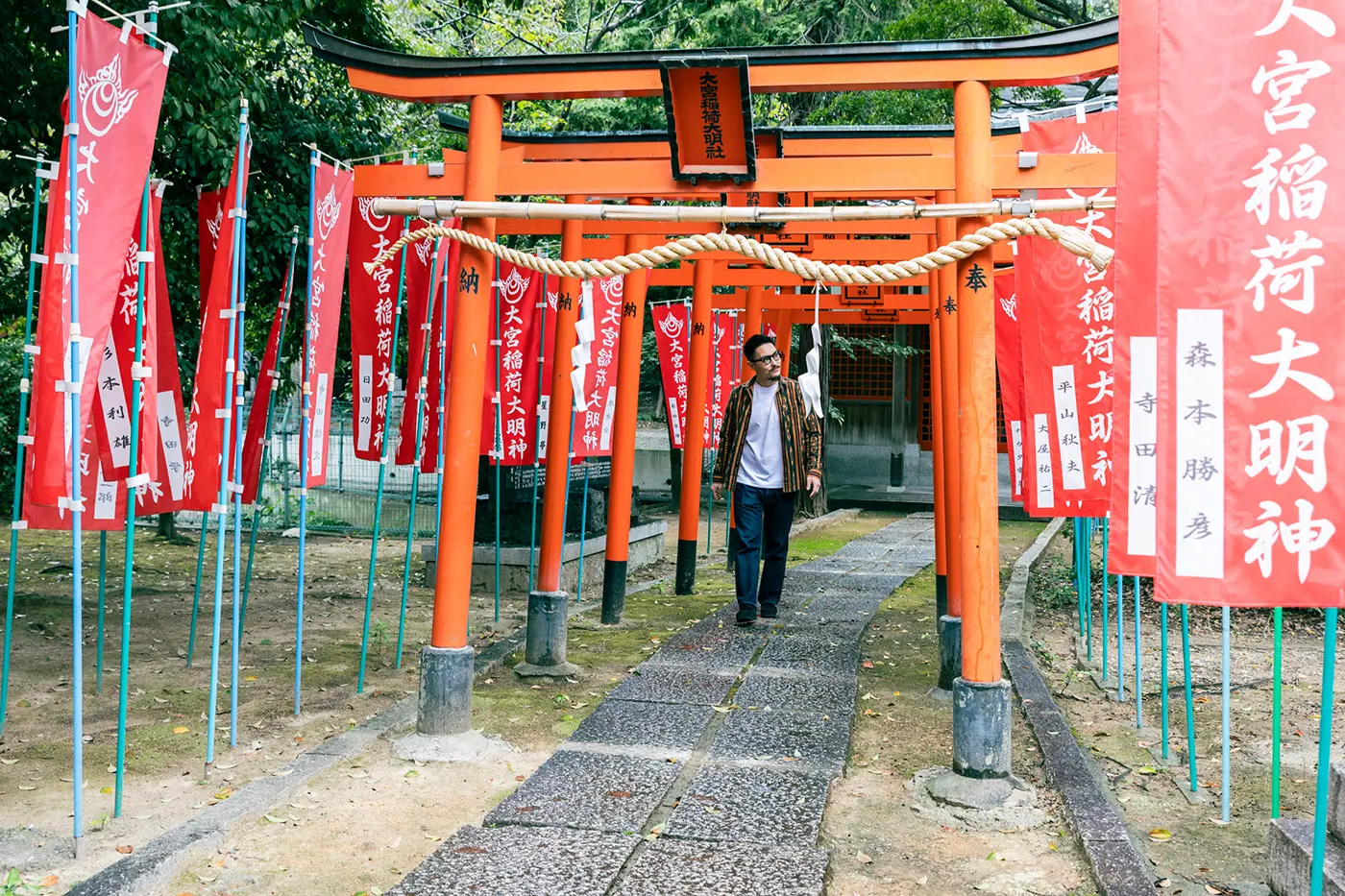 Passing through the rows of torii gates in the temple grounds