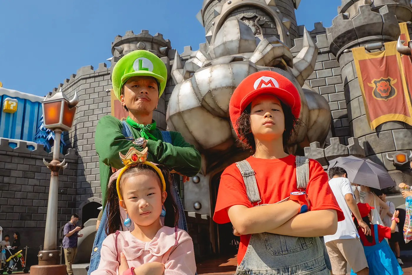 A family posing in front of the attraction