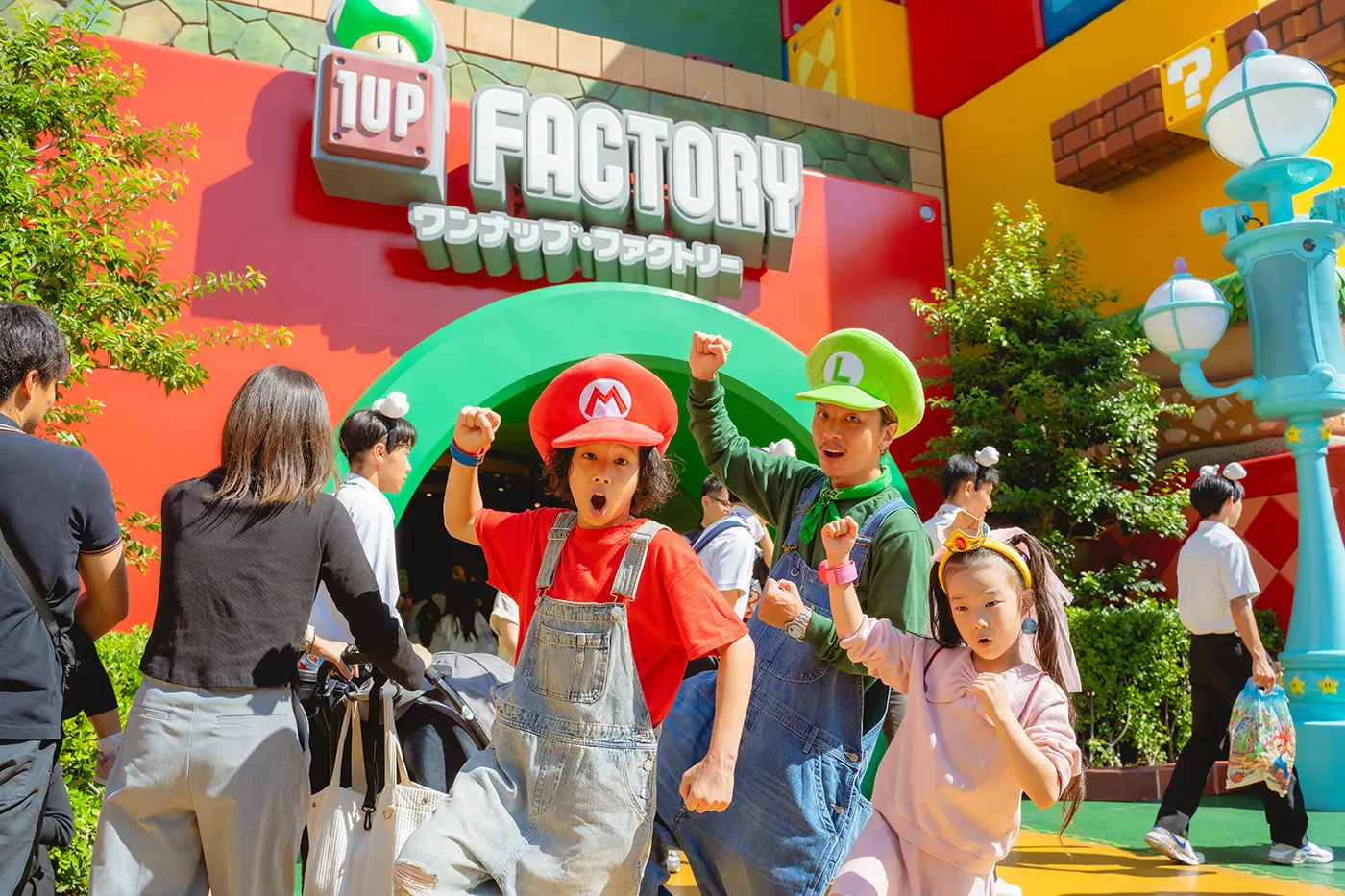 A family posing in front of the One-Up Factory