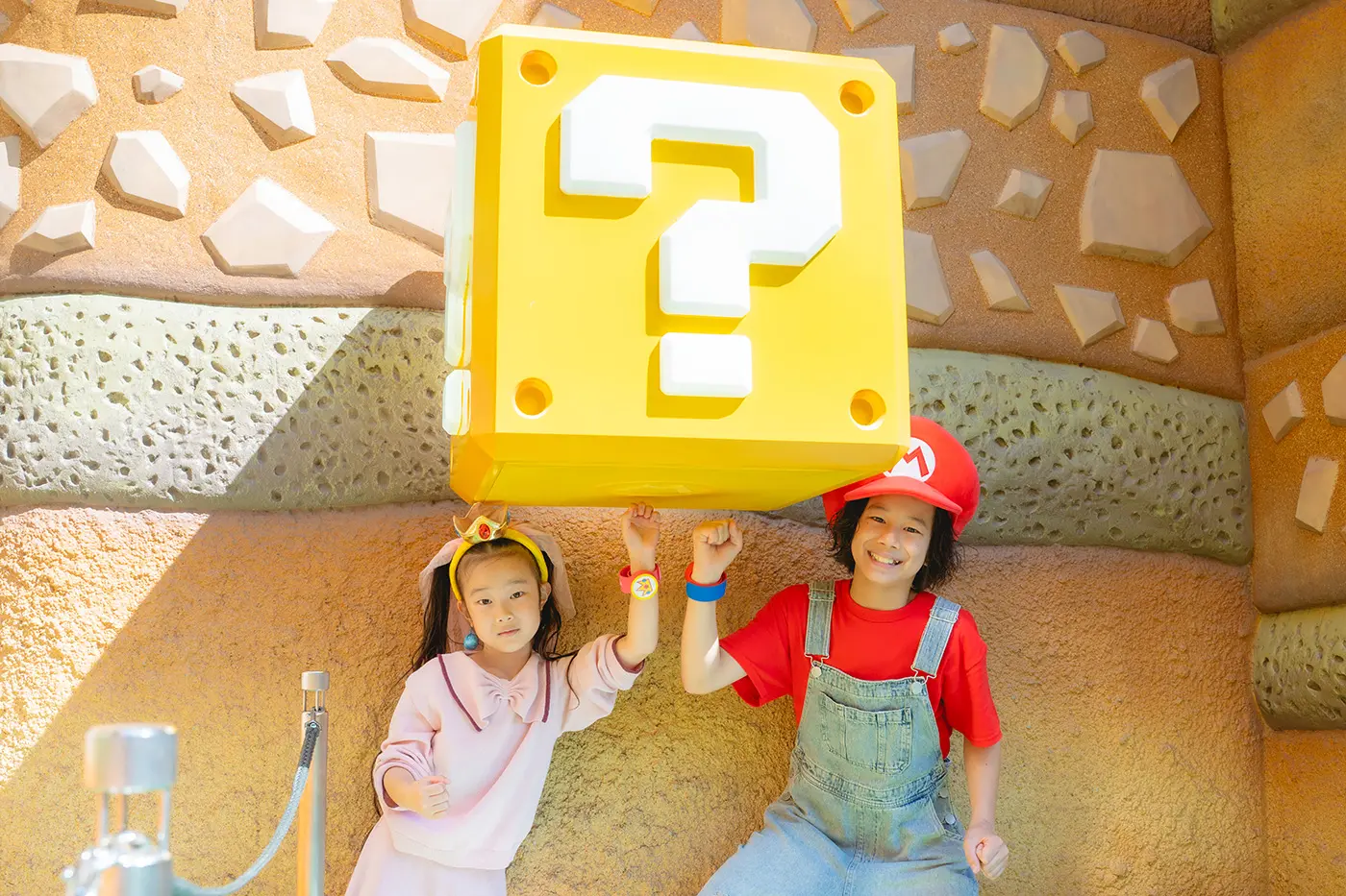 A child hitting a Mario block