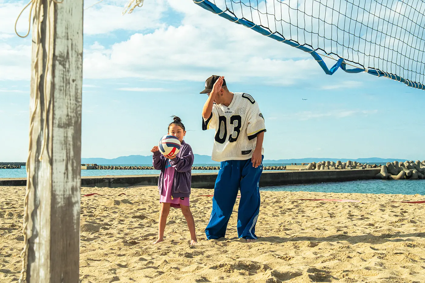 Parents and children enjoying volleyball