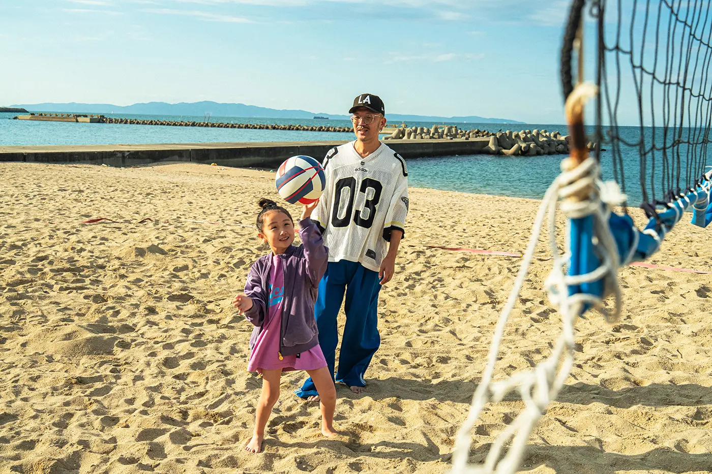 Parents and children enjoying volleyball