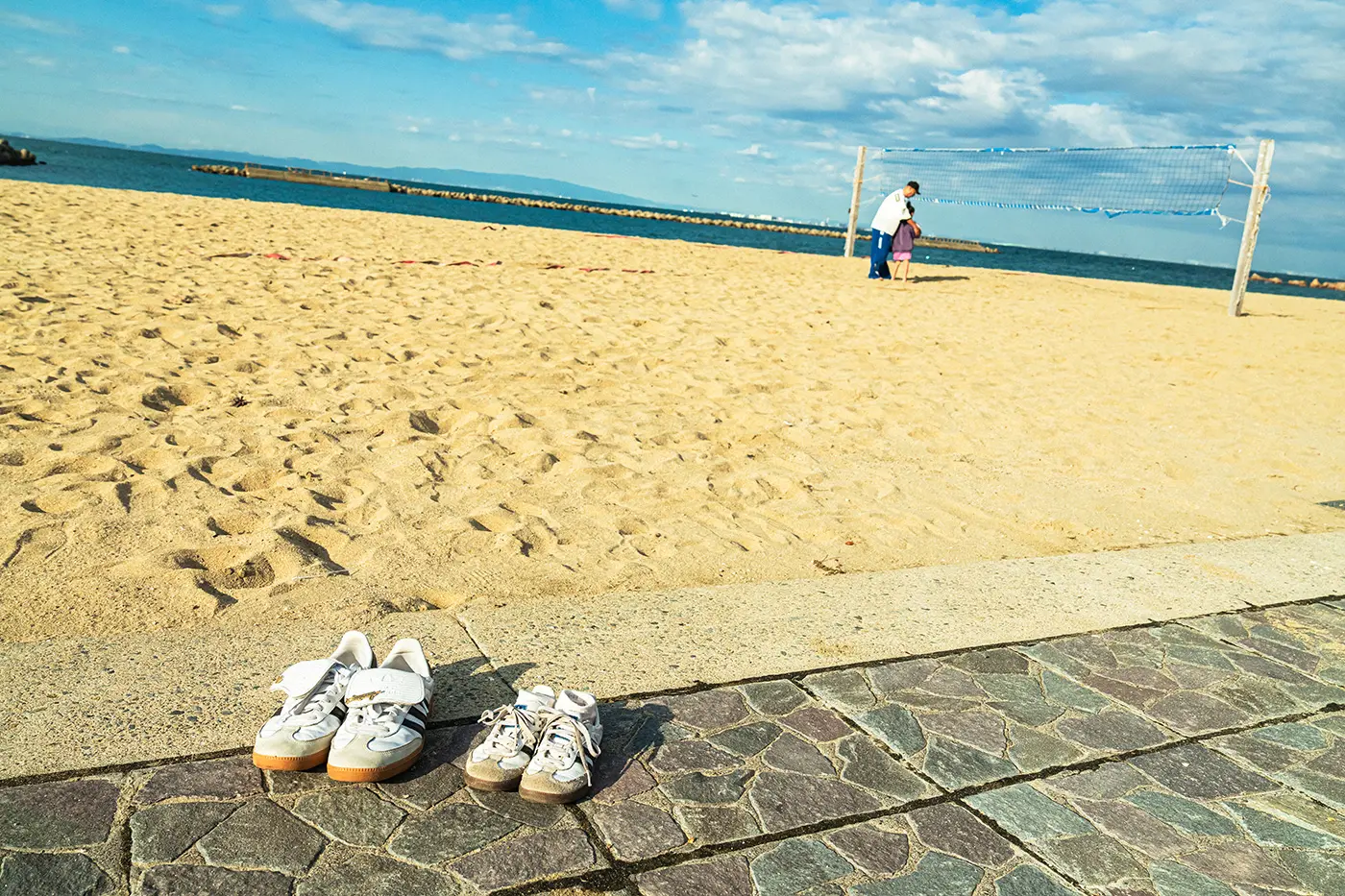 Parents and children enjoying volleyball