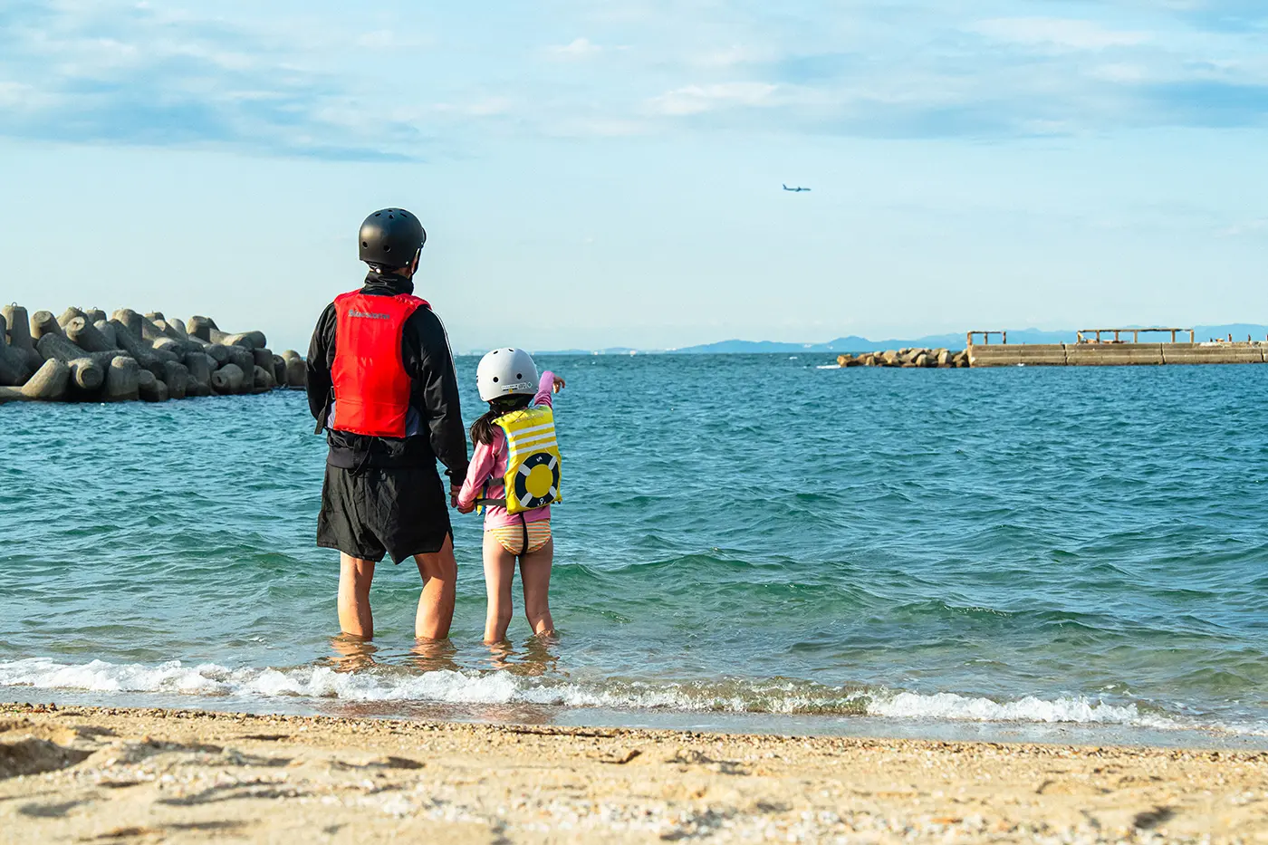 Parent and child looking at the sky