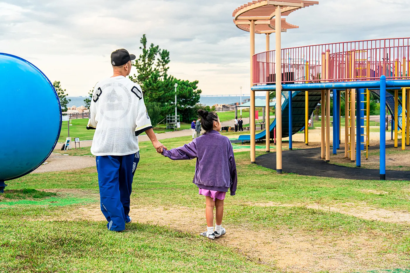 Parents and children walking in the park
