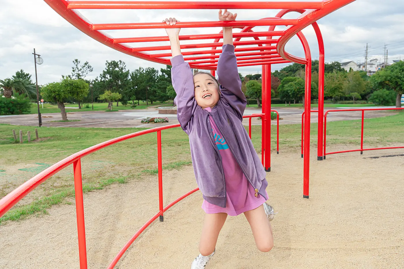 Girl doing monkey bars