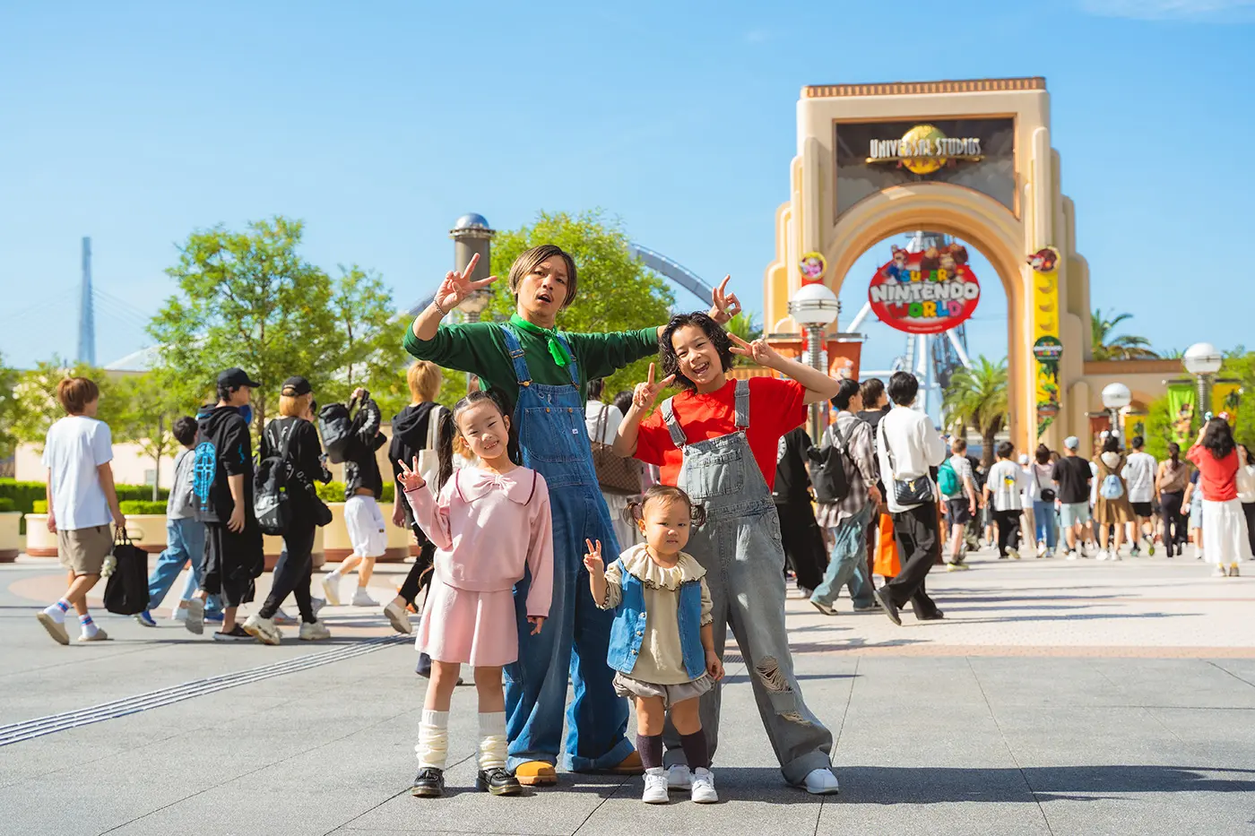 A family in front of the entrance to Universal Studios Japan